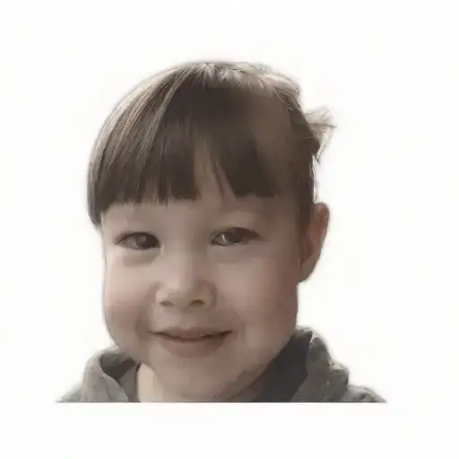 A Little Girl With A Smile On Her Face