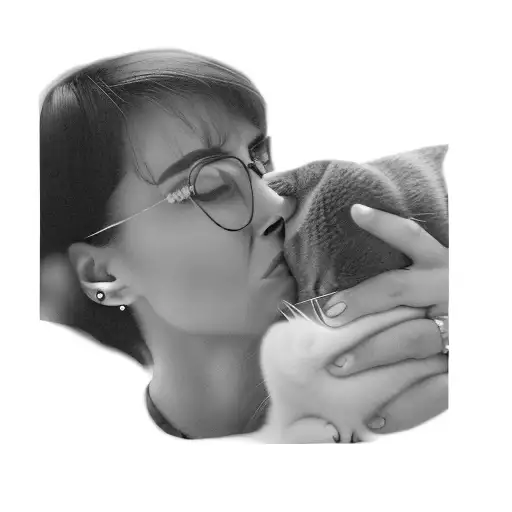 A Woman With Glasses Kissing A Cat