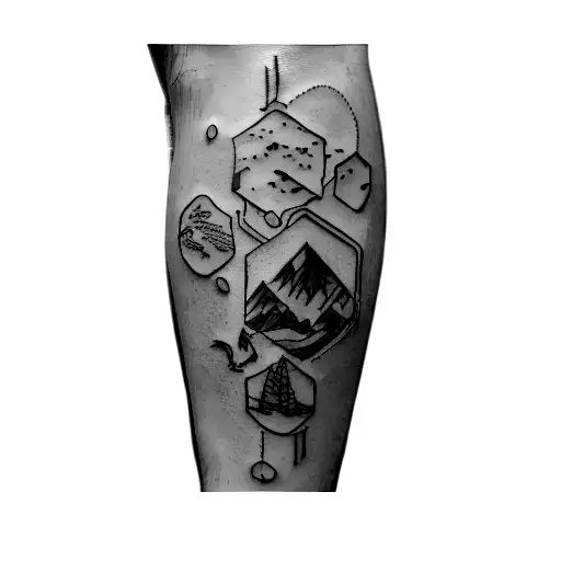 A Man's Leg With A Tattoo Of A Car And Mountains