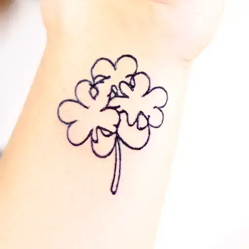 A Tattoo That Is A Three Leaf Clover With Each Clover Representing A Letter B And E And C