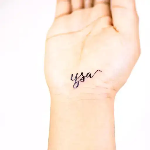 Small Fine Line Tattoo On Inside Of Wrist That Says Ysa